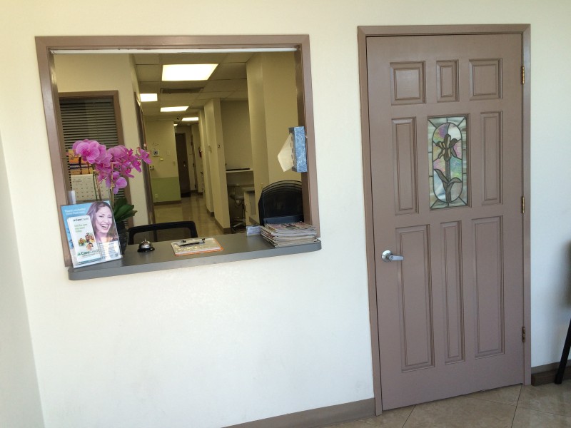A lobby with mauve-colored door