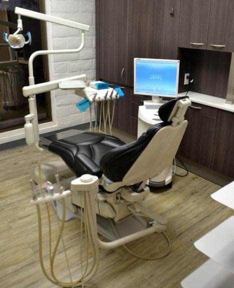 A dental clinic with black dental chair